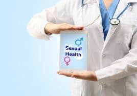 Doctor holding a sign up that says sexual health