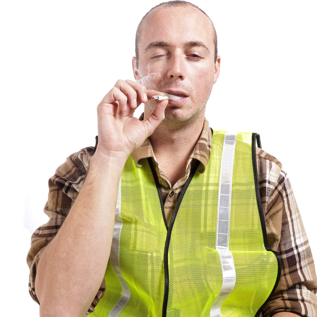 man in high-visibility vest smoking a cigarette while being visibly impaired